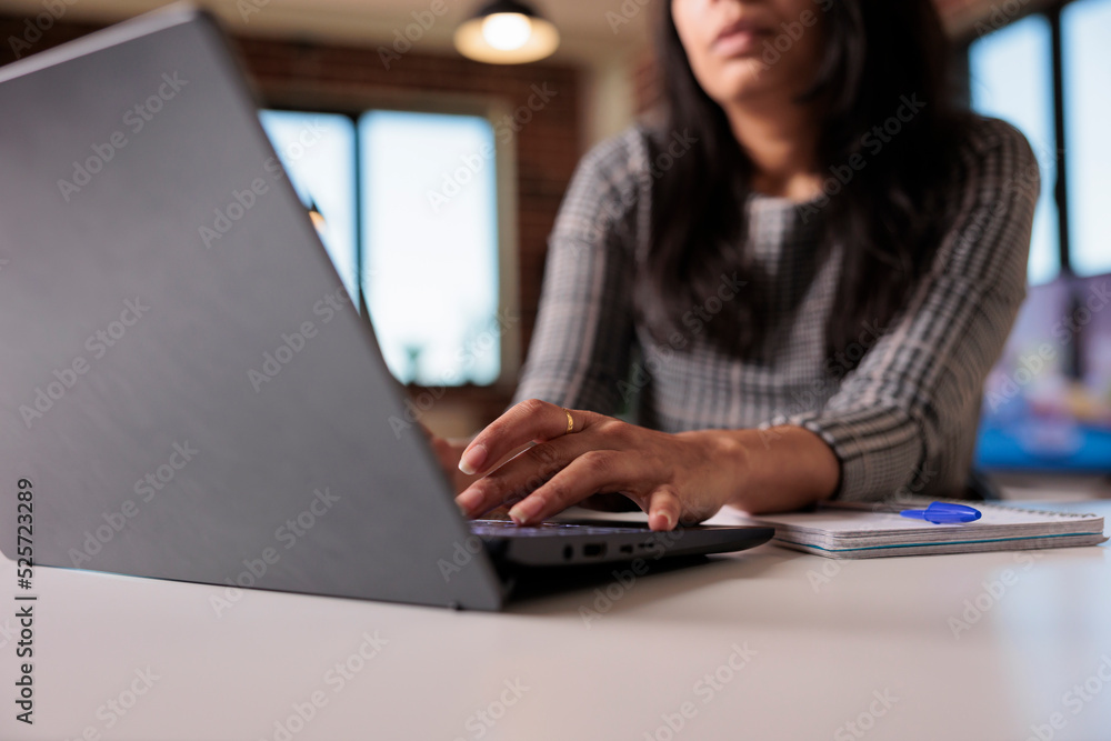 Poster female freelancer working on report at home, typing research information on laptop and browsing inte