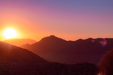 Pink sunset in the Phoenix Arizona Sonoran Desert mountains