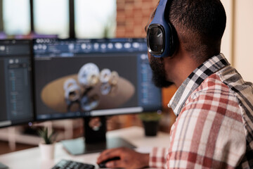 Male freelancer working on machinery construction using cad engineering software on computer....