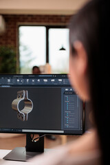 Asian freelancer working on product development with gears and engine machinery. Technician using...