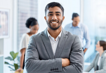 Coaching, motivation and happy, proud business leader in meeting with diverse colleagues in an office. Portrait male smiling during training with workers, discussing improvement and strategy planning