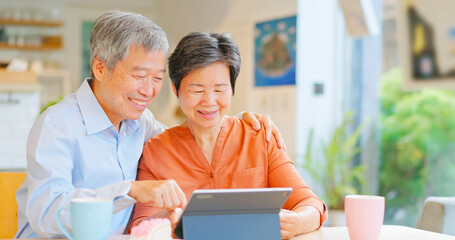 old couple use tablet