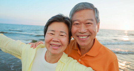 elderly couple smile at you