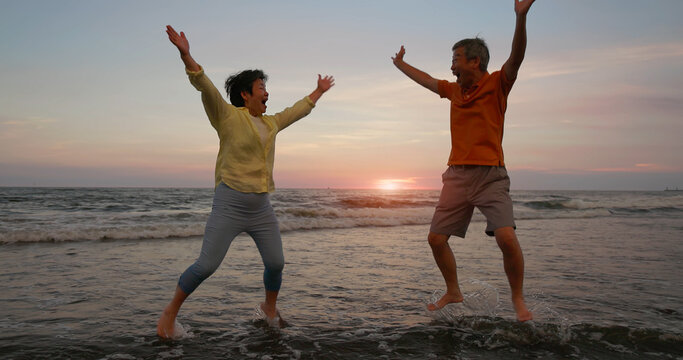 elderly couple take a jump