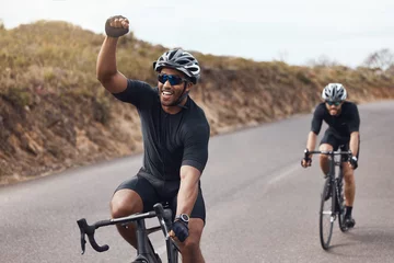 Foto auf Acrylglas Winner, celebrating and winning cyclist cycling with his friend and racing outdoors in nature. Victory, joy and happy bicycle rider exercising on a bike for his workout routine on the road © Clement Coetzee/peopleimages.com