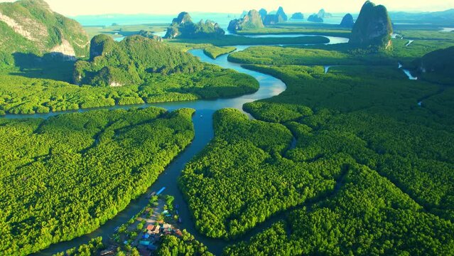 An aerial view from a drone flying over Phang Nga Bay. Phang Nga Bay tours are a favorite of tourists and the world's most popular tourist destination. Phang Nga, Thailand. nature and travel concept
