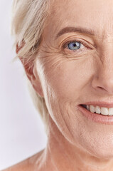 Beauty, skincare and senior face model showing wellness, health and youth in studio with white...