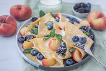 Delicious homemade crepes with blueberries and riccota 