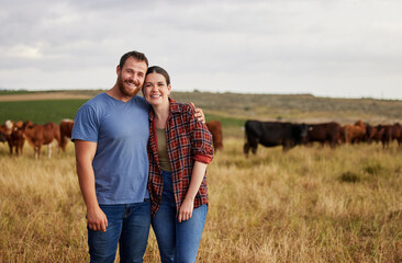 Farmer couple working on cow farm in the countryside for meat, beef and cattle food industry on...
