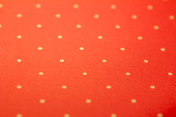 Full frame abstract texture background of solid red and yellow polka dots pattern with selective...