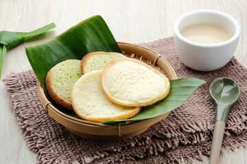 Serabi or Surabi,  Indonesian pancake made of flour, rice flour and coconut milk. Served with palm sugar sauce. Sweet and savory. 
