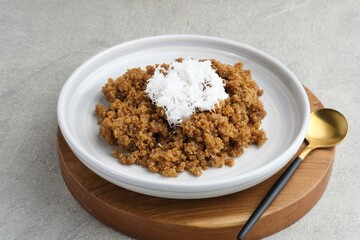 Tiwul, a traditional Indonesian food, is a staple food substitute for rice made from cassava. Usually eaten with a sprinkling of grated coconut. 