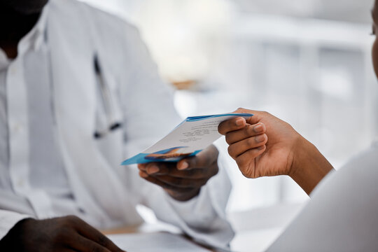 Hands Of Doctor Giving Flyer To Patient About Hospital Help, Medical Clinic Contact Us Information. Sick Black Woman With Health Problem Consulting A Professional Healthcare Worker, Nurse Or Expert