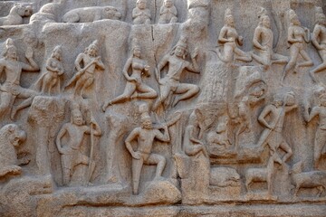 Descent of the Ganges: A giant open-air rock bas relief carved on two monolithic rocks in Mahabalipuram. It contains sculptures of animals, God, people and half-humans carved in the rock relief.