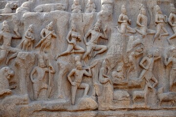 Descent of the Ganges: A giant open-air rock bas relief carved on two monolithic rocks in Mahabalipuram. It contains sculptures of animals, God, people and half-humans carved in the rock relief.