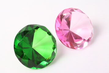 Green and pink diamond on white background