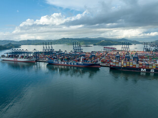 Fototapeta premium Shenzhen ,China - Circa 2022: Aerial view of container ship in Yantian port in Shenzhen city, China