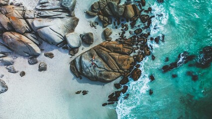 Fototapeta premium Aerial view of the beautiful rocky Clifton Beach in Cape Town, South Africa