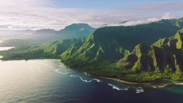 Exploring iconic ancient sites of Kauai Coast, Hawaii, USA. Aerial footage of adventurous journey destination with spectacular shoreline and sunset skyline in the background. High quality 4k footage
