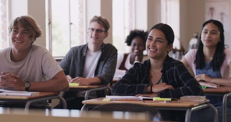 Education, learning and funny high school student group in a classroom sitting at a desk. Happy, teen and young adult students listening in class with a curious mind, smile and laugh ready to learn - Powered by Adobe