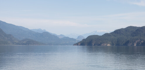 Harrison Lake during Sunny Summer Morning. Canadian Nature Landscape Background. Harrison Hot Springs, British Columbia, Canada.