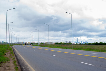 Fototapeta premium perspective of paved road and sky before rain