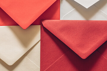 Different sizes and colors of textured paper open postal envelopes as a symbol of correspondence