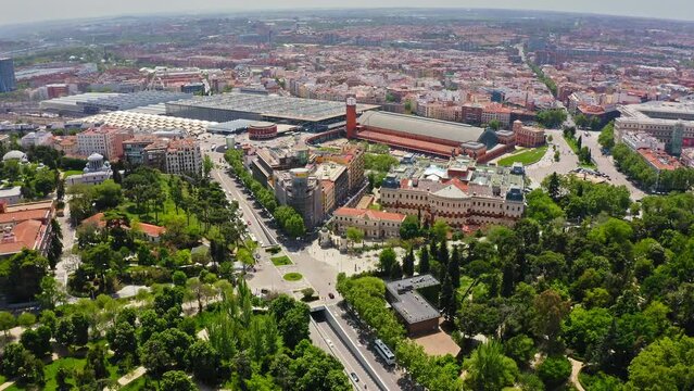 View from above beautiful busy city with historical buildings busy traffic intersection famous Atocha train station biggest railway station in Madrid capital of Spain beautiful cityscape modern city