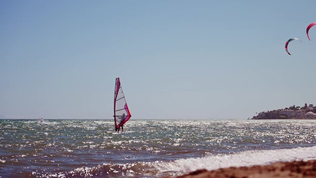 Slow motion windsurfer on the coast of Spain