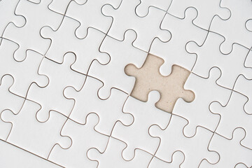 White jigsaw puzzle background for business concept of strategy solution