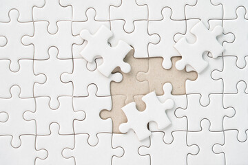 White jigsaw puzzle background for business concept of strategy solution