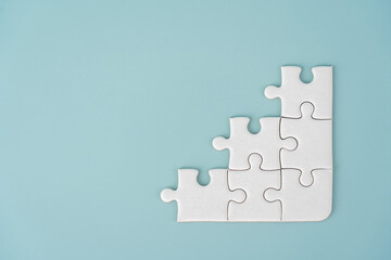 White jigsaw puzzle background for business concept of strategy solution
