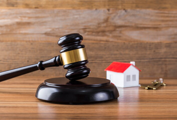 Judge hammer and model house, real estate dispute, real estate auction