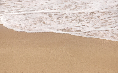 Waves Washing Up to Sandy Tropical Beach