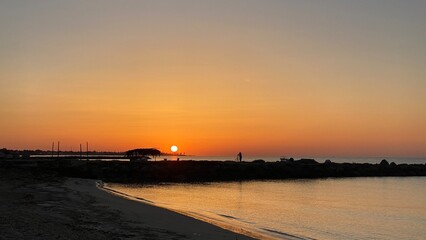 Obraz premium orange sunrise cloudless sky on island of Djerba