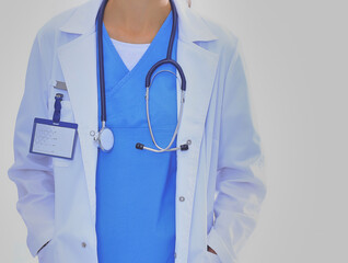 Beautiful young woman in white coat posing with hand in pocket. Woman doctor