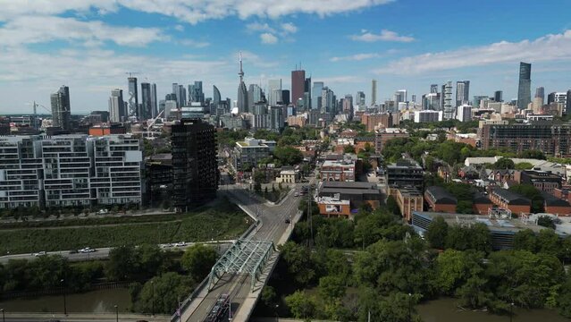 4K drone shot over Toronto's east side, with the downtown skyline in the background. Taken mid-day summer 2022
