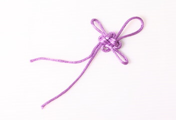 Purple Chinese decorative knots on white background