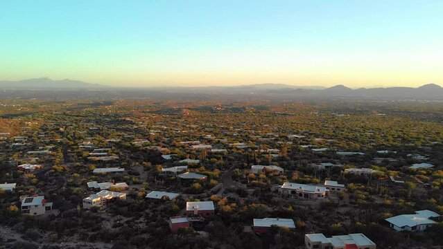 Amazing drone shot of homes and houses at sunset in Catalina mountains in Tuscon Arizona