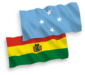 National vector fabric wave flags of Federated States of Micronesia and Bolivia isolated on white background. 1 to 2 proportion.