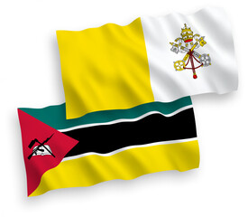 National vector fabric wave flags of Republic of Mozambique and Vatican isolated on white background. 1 to 2 proportion.