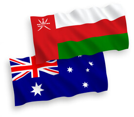 National vector fabric wave flags of Australia and Sultanate of Oman isolated on white background. 1 to 2 proportion.