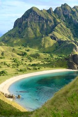 Padar Island is mostly savannah-covered, surreal landscape fringed by bright green-capped mountains...