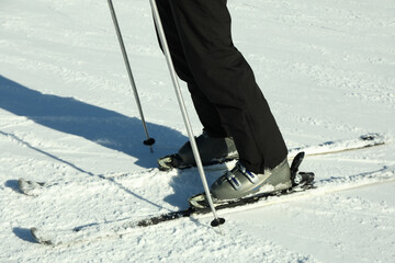 Skier legs on ski slope, ski season