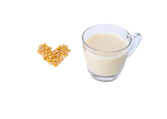 Soy milk is made from grinding soybeans. and bring to a boil to add sweetness with sugar healthy drink  Soy milk in a glass on a white background.