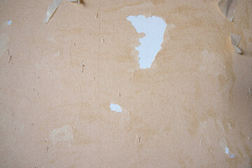 Beige background template of old torn paper wallpaper blank on a white wall