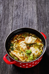 Asian Potsticker Soup in red pot, top view