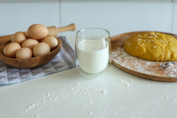 Baking ingredients placed on white table, ready for cooking. Concept of food preparation