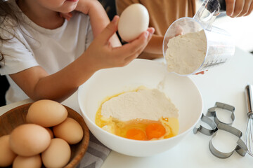 Happy children in the kitchen make cookies. Cooking master class