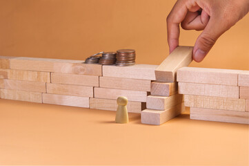 Hand arranging wood block stacking as step stair and close the gap to resolve the broken bridge...